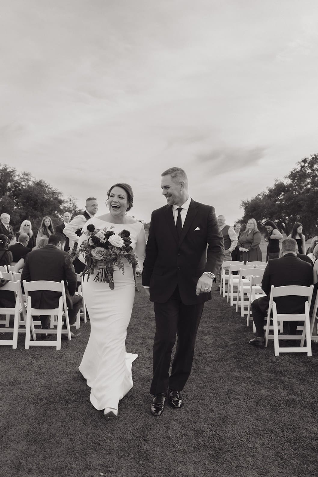 Bride and groom walking down aisle after ceremony