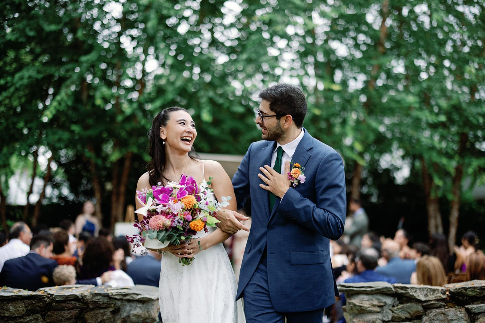 Bride and groom walking down the aisle by Austin Wedding Planning and Coordination